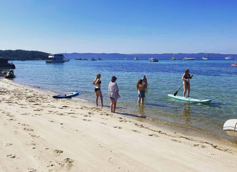 Brisbane: Half-Day Moreton Bay Sailing Cruise with Antipasto - Water time at anchor: paddleboards, the giant aqua mat, and beach walks