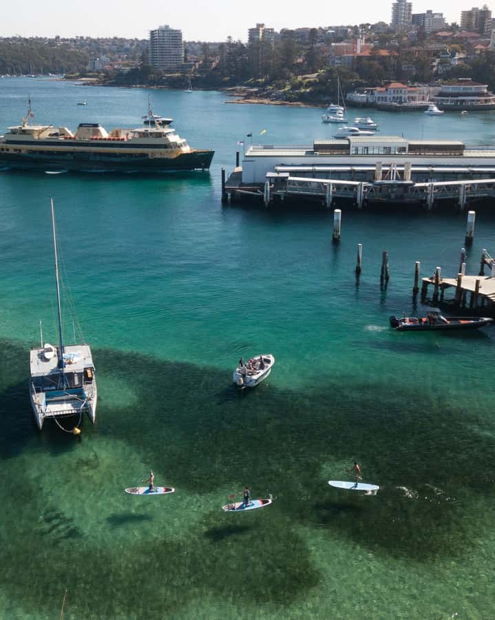 Manly Stand Up Paddle Board Hire - Paddling Past Moored Yachts: Slow Cruising vs Going Farther