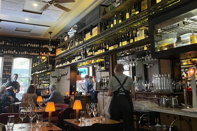 Melbourne Art, History, Wine & Food Walking Tour - An iconic wine bar stop: dark wood, cherry leather, handwritten wines