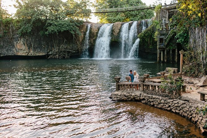 Paronella Park and Millaa Millaa Falls Full-day Tour from Cairns - Millaa Millaa Falls: famous falls, quick access, and cold-water reality