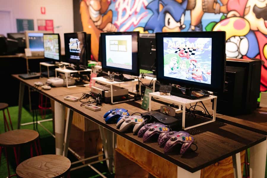 Perth: Video Game Console Museum - The console wall: 1970s to 2000s gaming evolution, explained with games