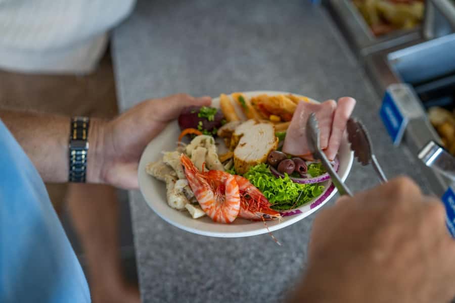 Port Douglas: Outer Barrier Reef Cruise & 10 Min Helicopter - Food, marine biologist briefing, and how the crew keeps things moving