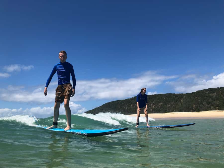 Rainbow Beach: 4WD Beach Drive Adventure and Surf Lesson - Entering the right surf zone at Double Island Point