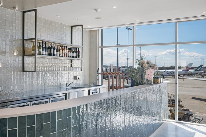 Sydney Airport Plaza Premium Lounge - The Space Itself: Views, Botanical Wall, and Seating That Lets You Breathe