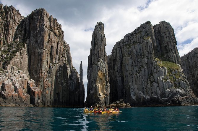 Tasman Peninsula full day kayaking tour - Kayaking under 200m cliffs: caves, Candlestick, and Totem Pole